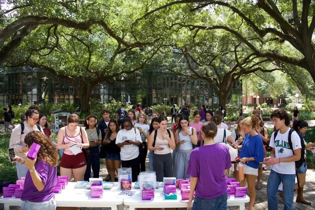 Students receiving product samples at a Tulane campus activation