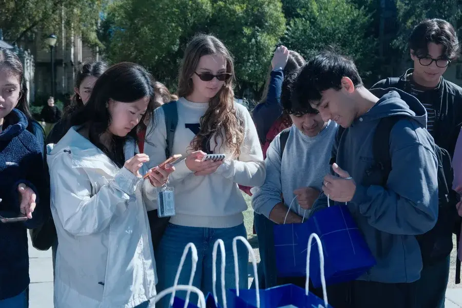 Students exploring skincare samples at a Yale campus activation